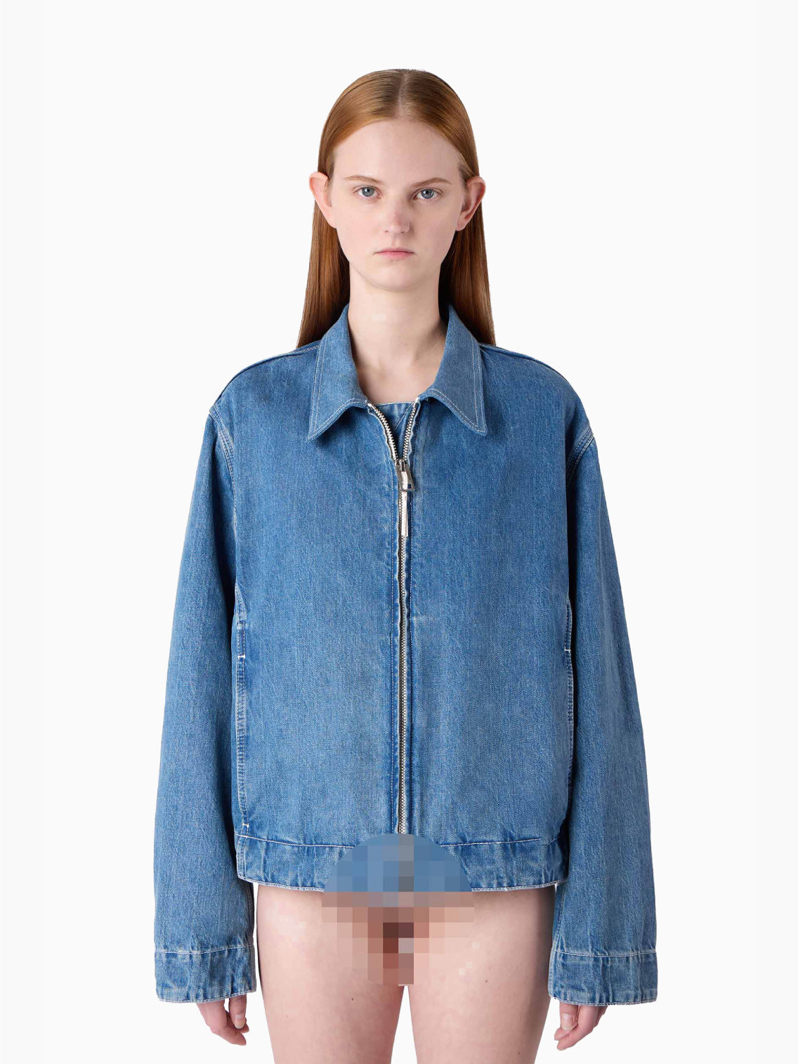 A light blue, organic bomber jacket made from raw denim, featuring a front zipper and long sleeves. The jacket includes a collar and two front pockets, exuding a casual, slightly faded look. A silicon Sunnei patch adds a unique touch, while the fabric tag inside the collar reads "Marni.