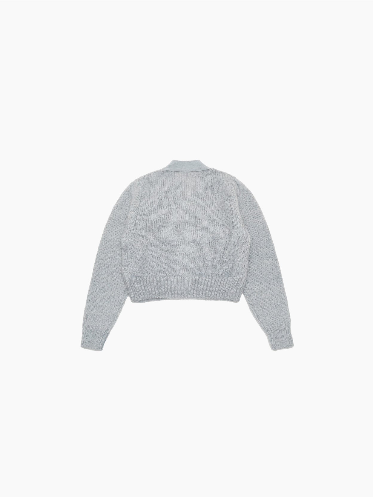 The Grandma Cardigan Light Mint from Amomento, featuring long sleeves and a V-neck, exudes a vintage feel. Laid flat on a white background, it showcases its soft texture and simple design while effortlessly retaining warmth.