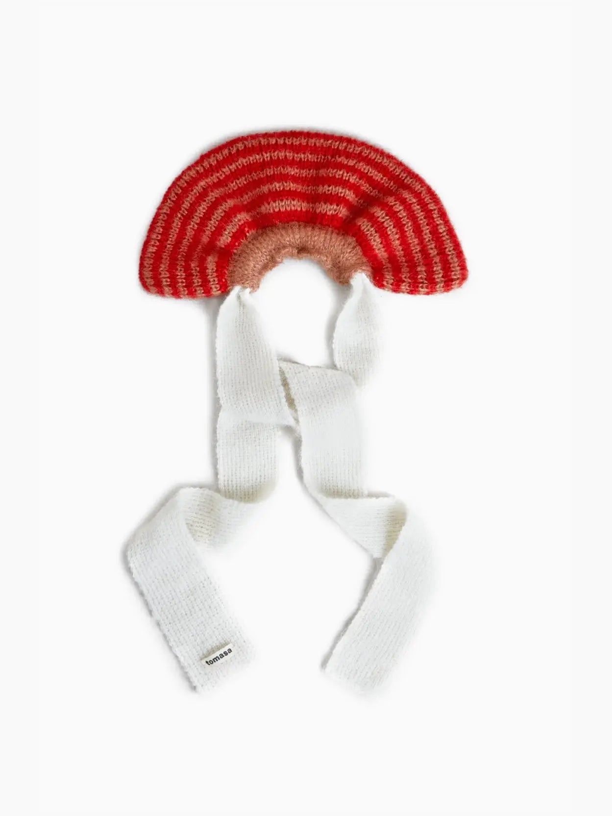 A whimsical Amapola Mohair Bow Scrunchie from Tomasa, colored in red and pink stripes, features long white knitted ties extending downwards. The scrunchie has a unique semi-circular shape, reminiscent of a rainbow. Available at our Barcelona store, the long ties are designed to wrap around for added warmth and style.