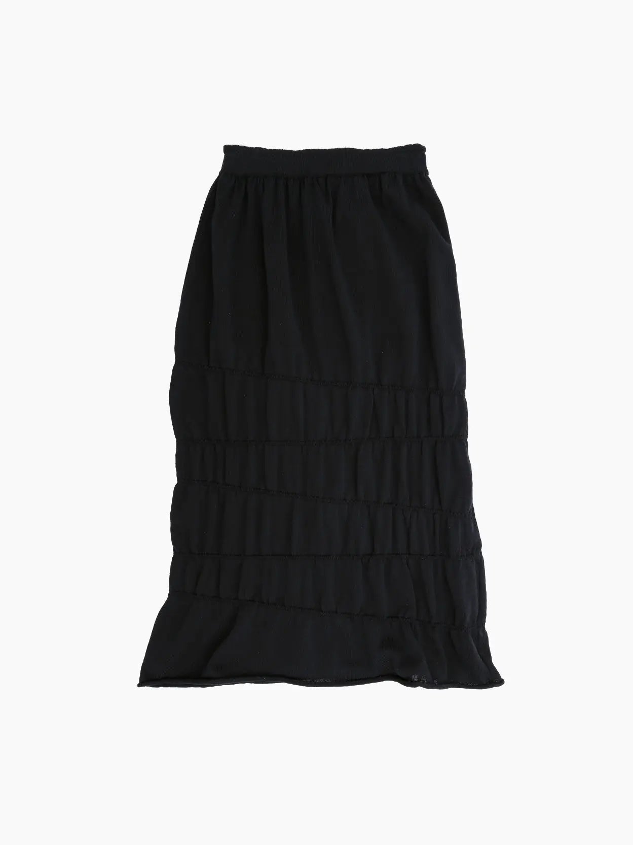 The Asa Skirt Black by Rus is a black, knee-length skirt with an elastic waistband and multiple horizontal ruffles throughout its length. The lightweight, flowy fabric makes it perfect for casual or semi-formal occasions. Available at BassalStore in Barcelona.