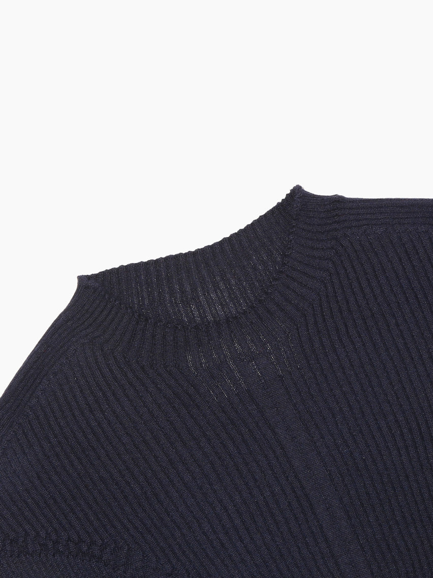 Displayed on a plain white background is the "Tisa Sweater Navy" from Bielo, a luxurious long-sleeve knit crafted with silk fibers. It features a fitted silhouette with visible ribbed details and a slightly scalloped hem, offering a second skin knitted design.