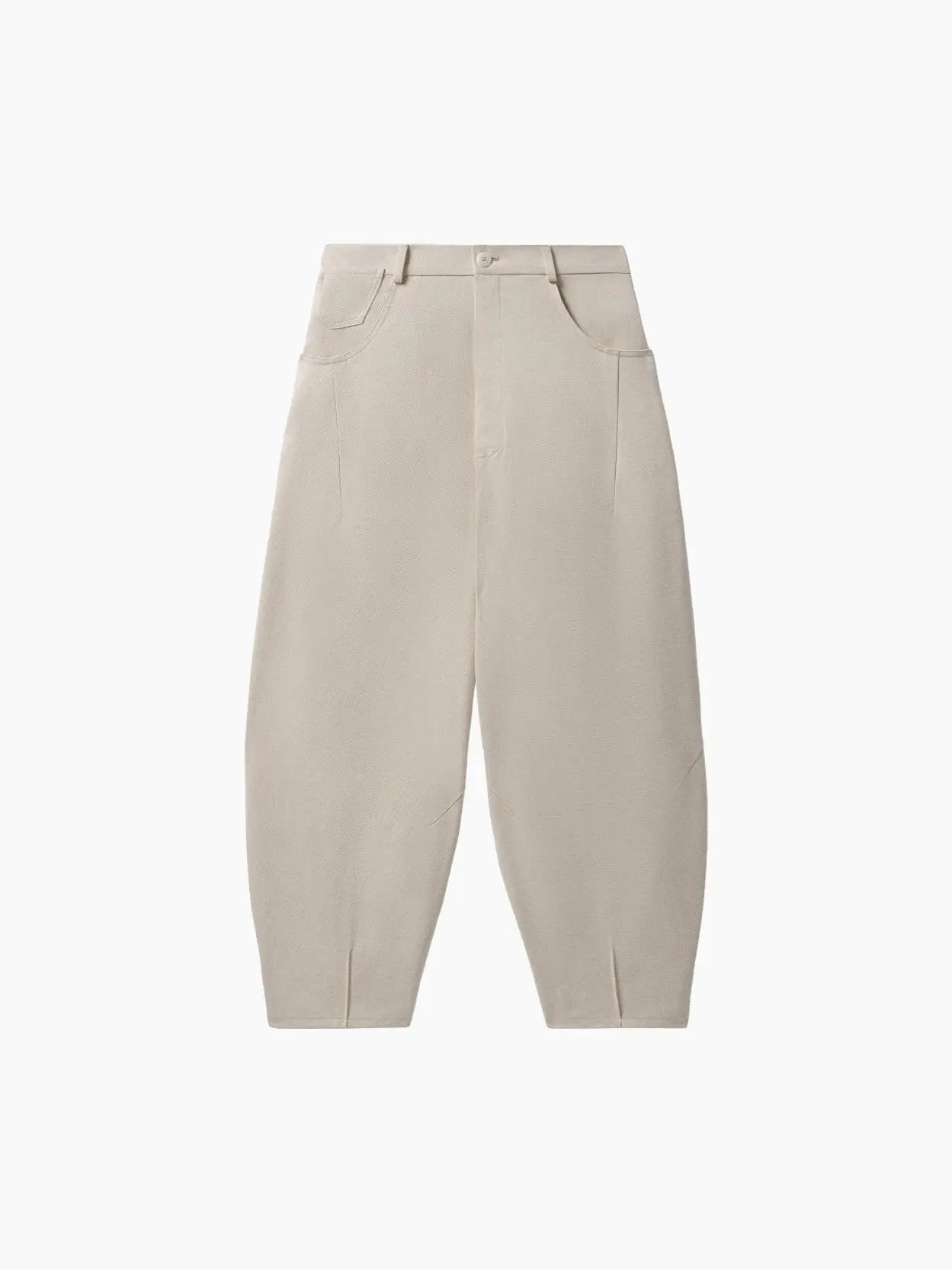 A pair of beige Baggy Pants Alabaster by Cordera with a high waist and a loose, slightly tapered fit, available at Bassal Store in Barcelona. The pants feature a button and zipper closure, belt loops, and front pockets. The fabric appears smooth and lightweight.