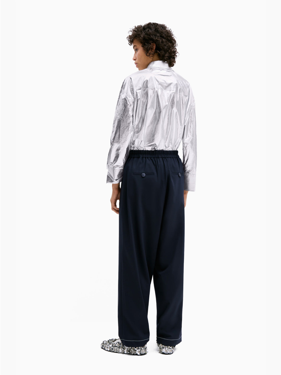 A pair of Tailoring Stitch Pants Navy by Cordera with a high waist and a button on the waistband. Featuring subtle pleats down the front and a slightly cropped length, these navy pants are a contemporary design that make for a perfect wardrobe staple.