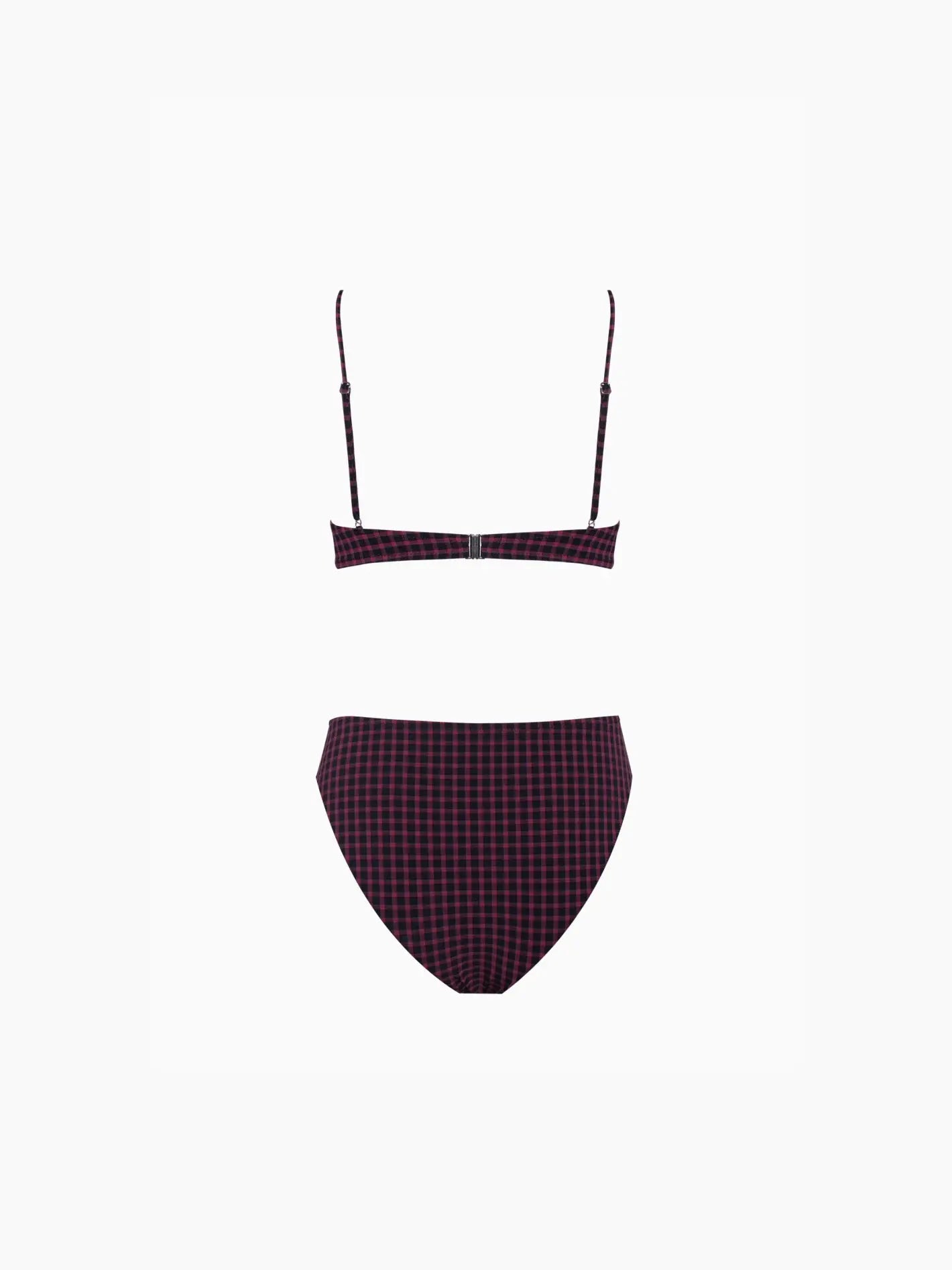 A chic Cleo Bikini Violet with a purple and black checkered pattern, exclusively available at Bassalstore in Barcelona. The top features thin spaghetti straps and a small cut-out in the center, while the bottoms showcase a high-cut leg design. The swimsuit is displayed against a plain white background by Pale.