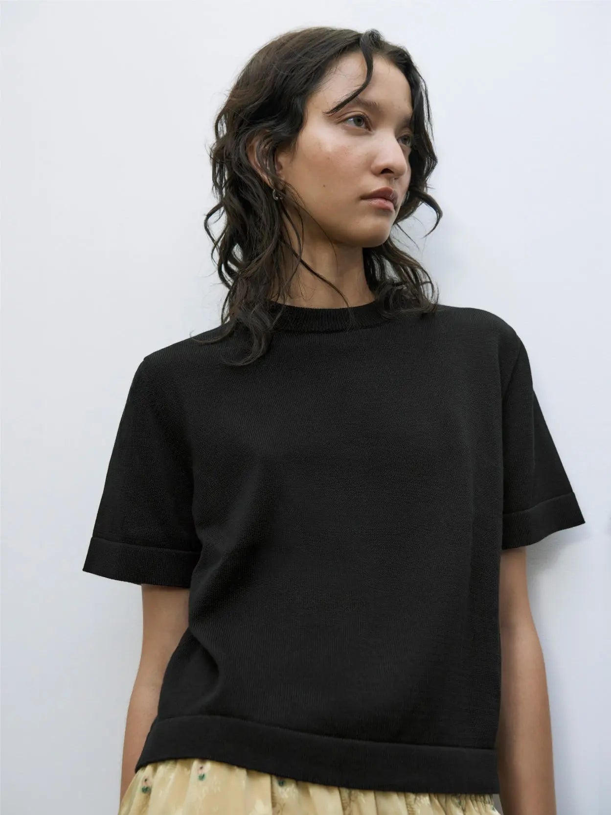 A Cordera Cotton T-Shirt Black is displayed on a white background. The shirt features a round neckline and a simple, classic design with no visible logos or patterns, perfect for your next visit to BassalStore in Barcelona.