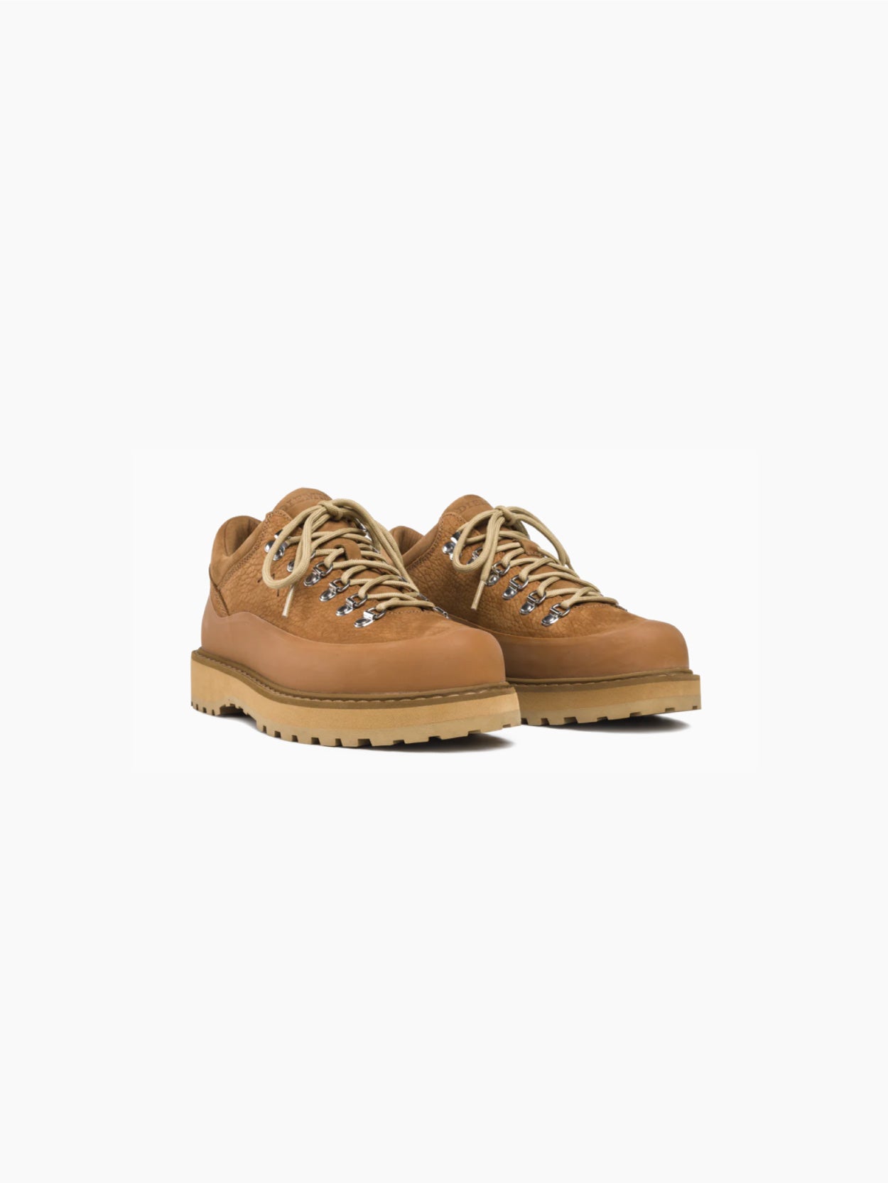Presenting the Cornaro Gomma Cognac Leather Shoe from Diemme: A single brown leather hiking shoe with a sturdy, grooved sole. This low-top boot features metal eyelets and two-tone laces, designed for rugged outdoor use. Highlighted against a white background, the shoe boasts waterproof suede detailing that emphasizes its durable construction.