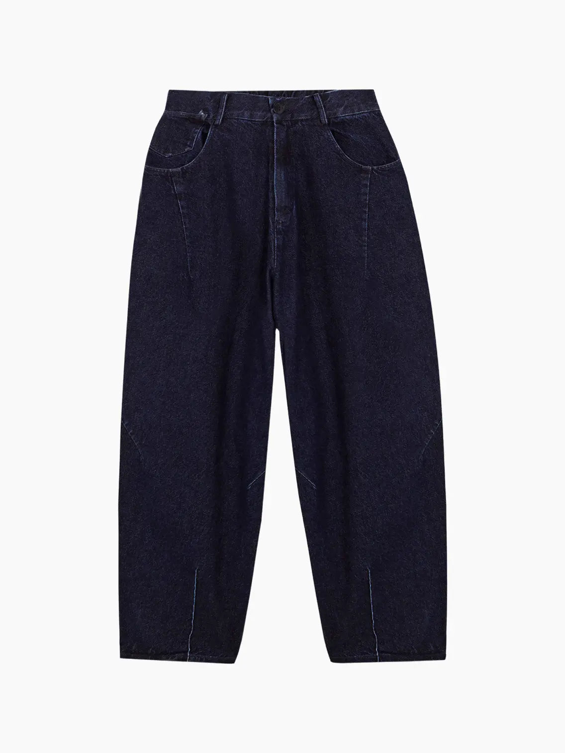 A pair of dark blue, high-waisted Denim Baggy Pants by Cordera with a relaxed, wide-leg fit. The pants feature side pockets, front zipper closure, and contrast stitching along the seams. Available at BassalStore in Barcelona, the fabric appears to have a slightly worn-in texture.