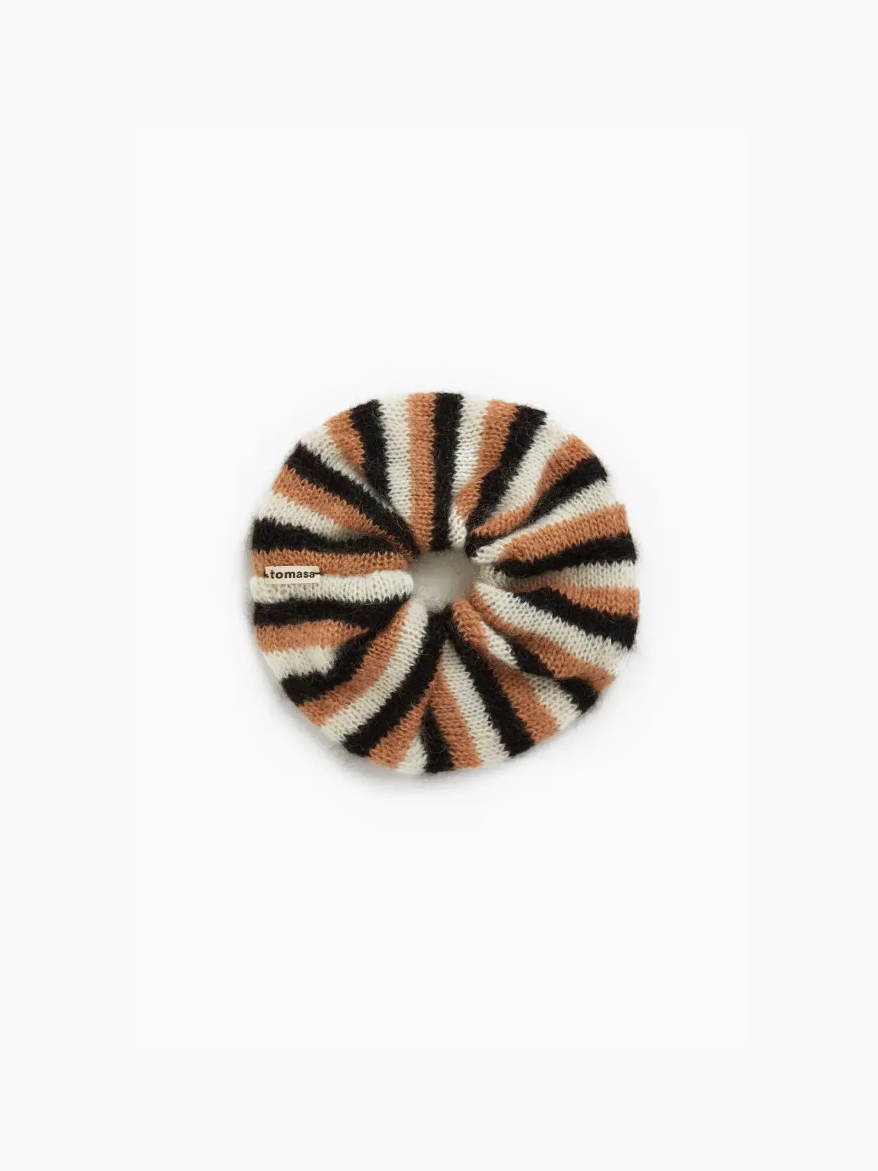 A fuzzy round Tomasa Eugenia Scrunchie with alternating stripes of cream, brown, and black is available at Bassalstore. The scrunchie has a soft texture and a tightly gathered center.