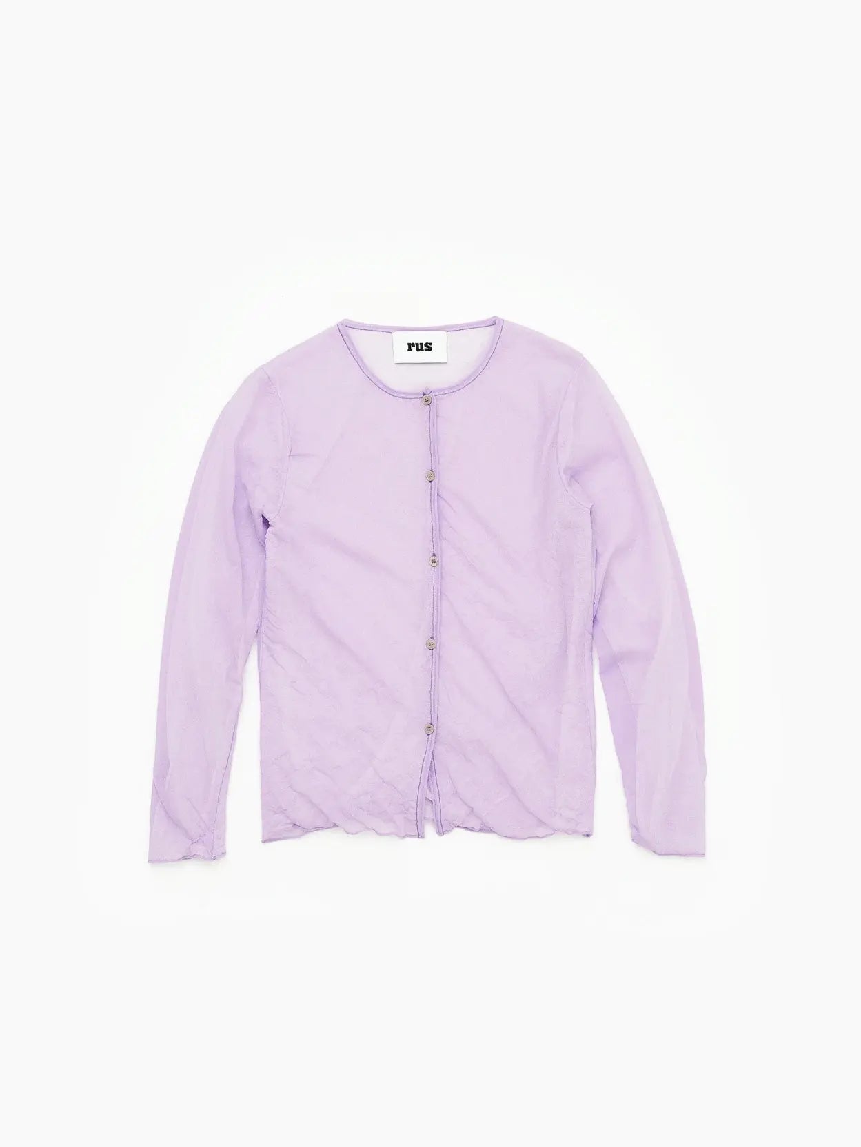 A light purple, long-sleeved button-up shirt with a round neckline is laid flat on a white background. The Garasu Cardigan Mauve, by the brand "Rus," available at BassalStore in Barcelona, has a simple and minimalistic design.