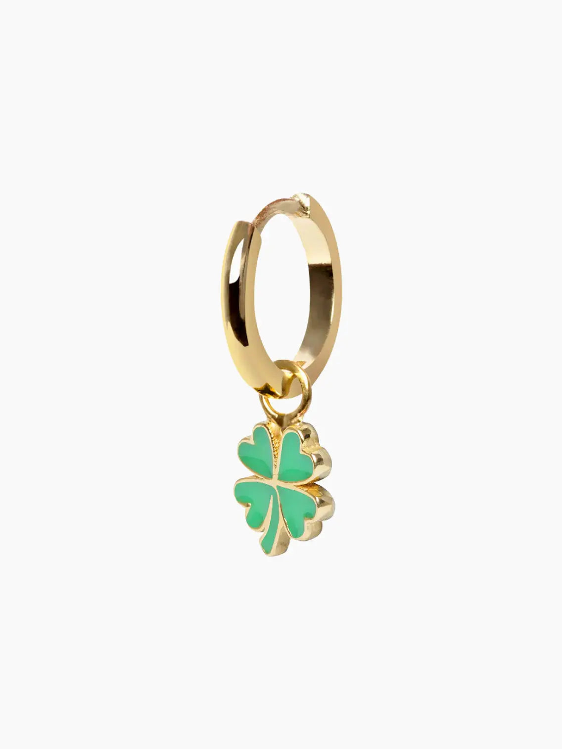 A close-up of a Gold Clover Earring with a dangling green four-leaf clover charm by Wilhelmina Garcia. The earring has a polished finish and the clover charm adds a touch of color. Found exclusively at Bassalstore in Barcelona, the plain white background makes the earring stand out beautifully.