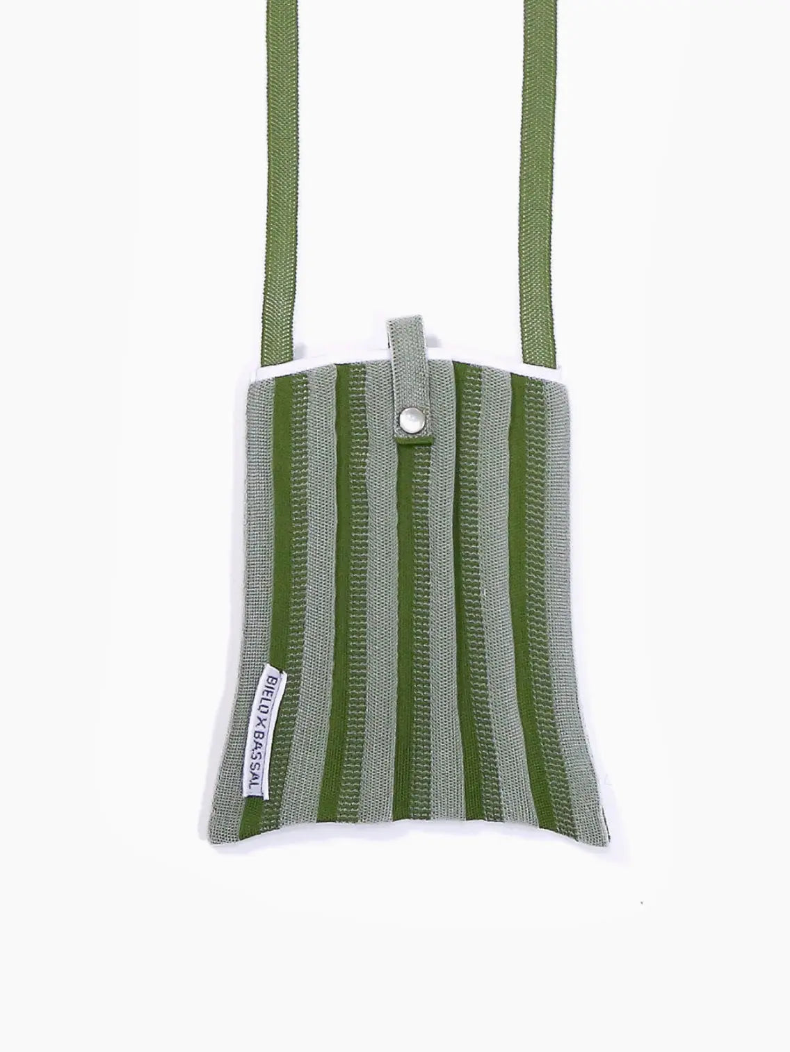 A small green and gray striped fabric bag with a shoulder strap. The Green Shoulder Bag features a snap button closure at the top and a small rectangular label with text on the lower left side. Proudly displayed by Bielo x Bassal Store, this stylish accessory brings a touch of Barcelona charm to your wardrobe against a plain white background.