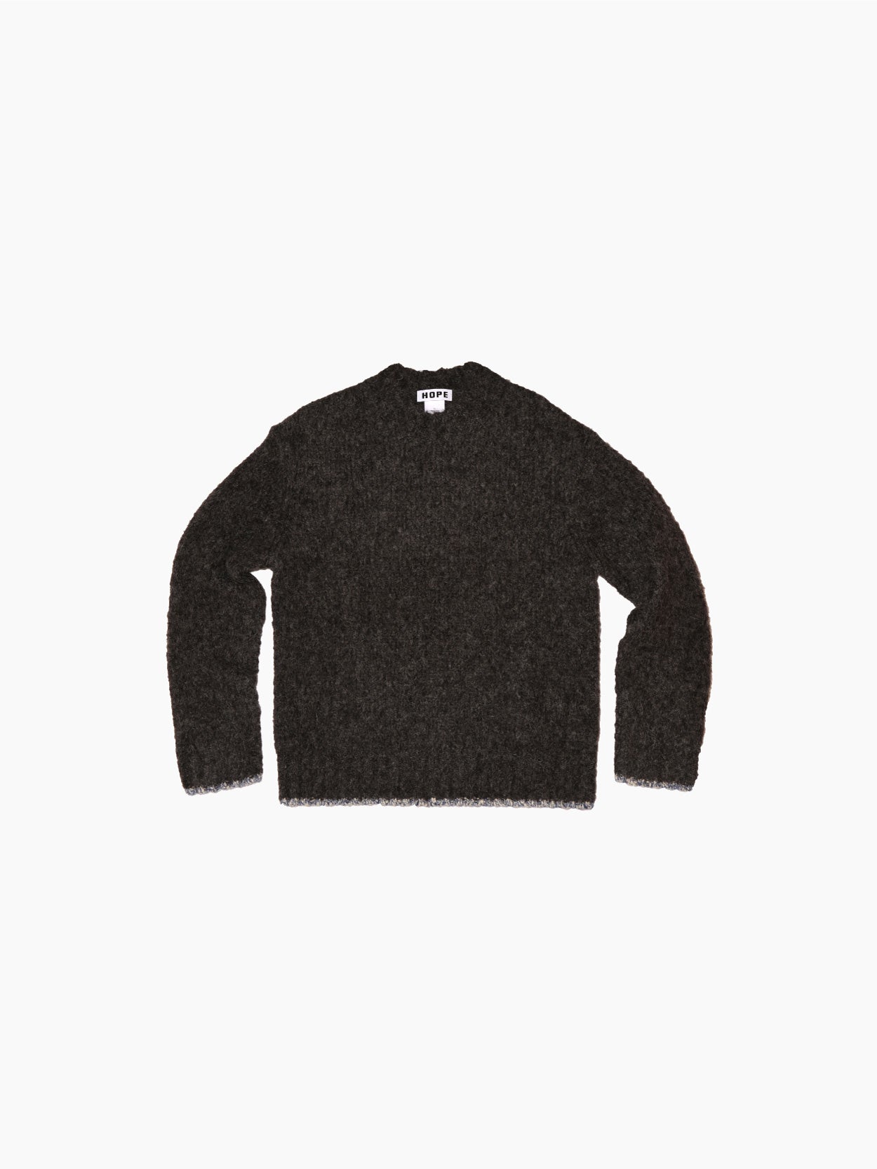 A "Box Sweater Grey" by Hope, featuring a dark gray, long-sleeve knit design with a V-neckline, is displayed against a white background. Made from soft alpaca yarn, the label inside the collar reads "REPRESENT." The sweater's texture looks soft and fuzzy.