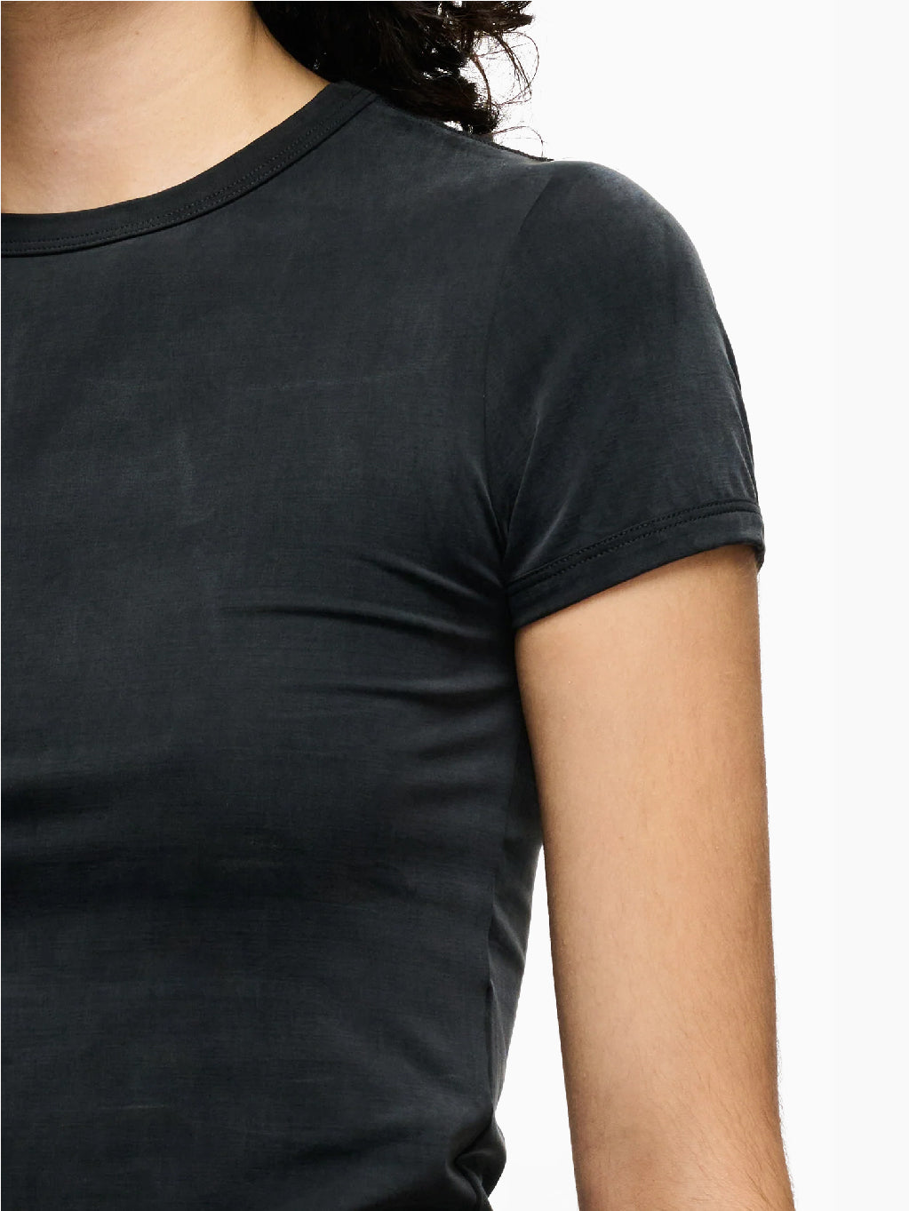 A short-sleeve, black velvet Vile T-Shirt Black, with a slight wrinkling on the front, laid flat on a white background. The collar label reads "Hope." This t-shirt boasts a washed silky look, adding an extra touch of elegance.