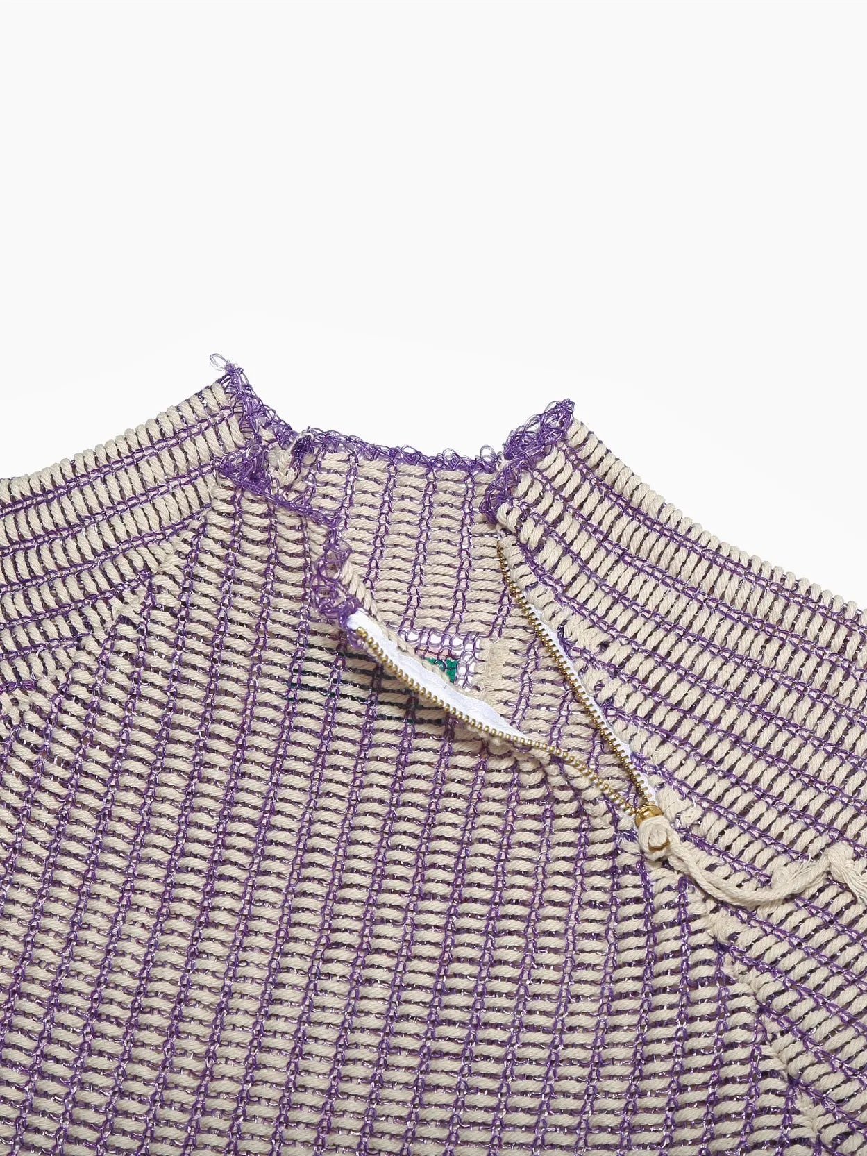 A wide-sleeve, knitted Keya Sweater Lavender from Bielo in a light purple color with a loose fit. The design features horizontal ribbed patterns and slight, rounded neck detailing. The hem and sleeve edges have subtle, dark purple accents. The top is laid flat on a white background.