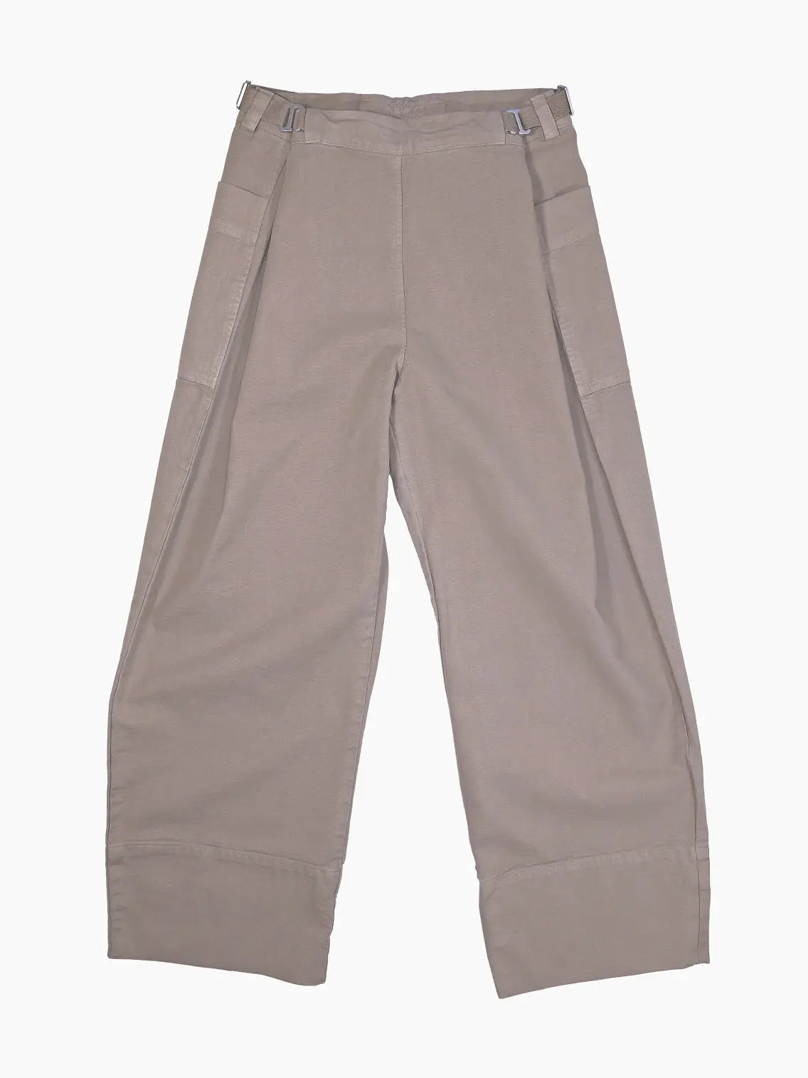 A pair of Khaki Pants designed with adjustable buckles on the waistband by Bastida x Bassal Store. The pants feature front pockets and a relaxed fit, made from a soft, comfortable fabric. Available exclusively at BassalStore in Barcelona.