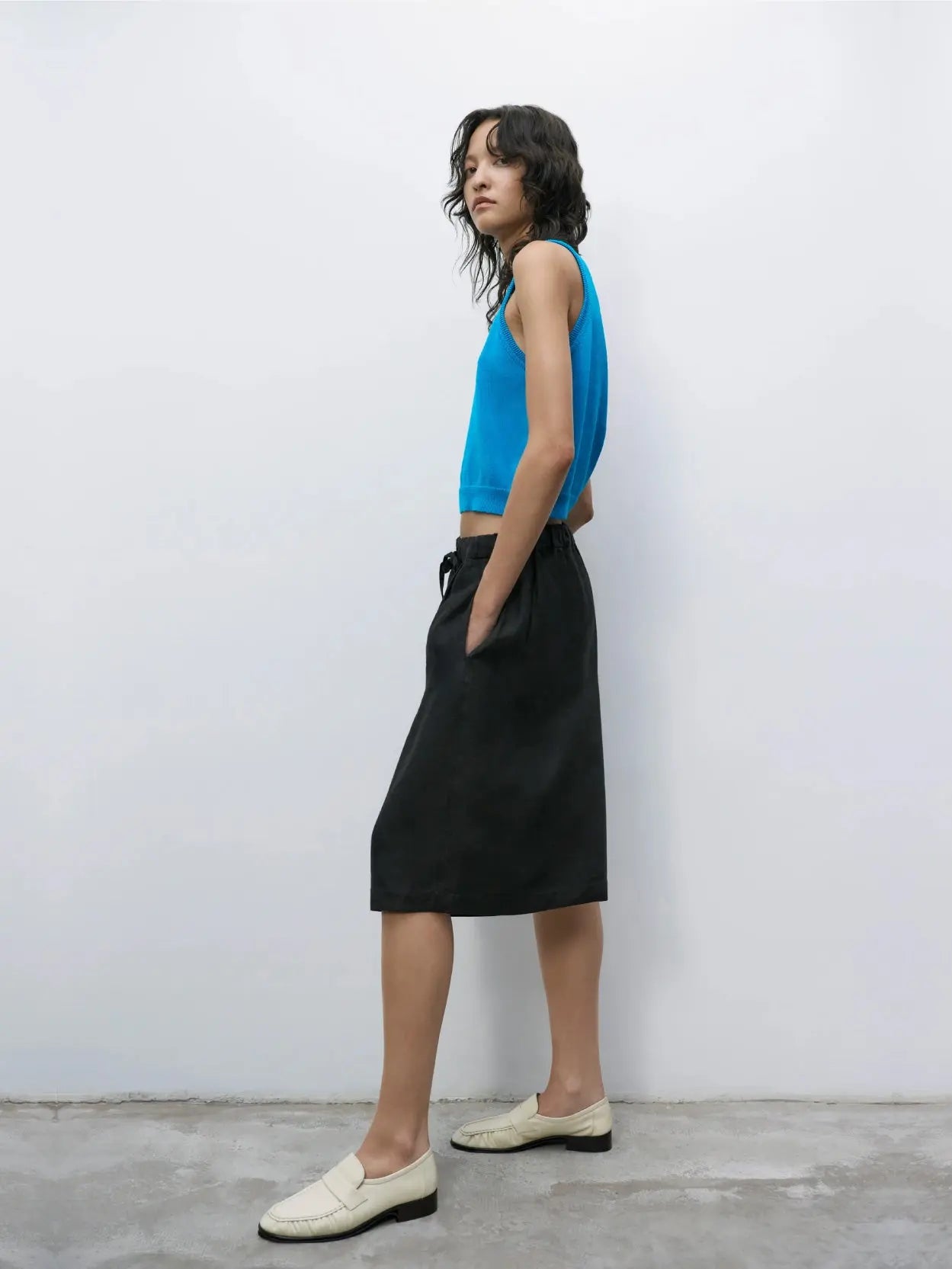 A pair of black, knee-length shorts with an elastic waistband and drawstring, laid flat on a white background. The fabric appears to be lightweight and comfortable, suitable for casual or athletic wear—perfect for browsing through the vibrant streets of Barcelona or grabbing gear from bassalstore. The Linen Maxi Bermuda Black by Cordera would be an excellent choice.