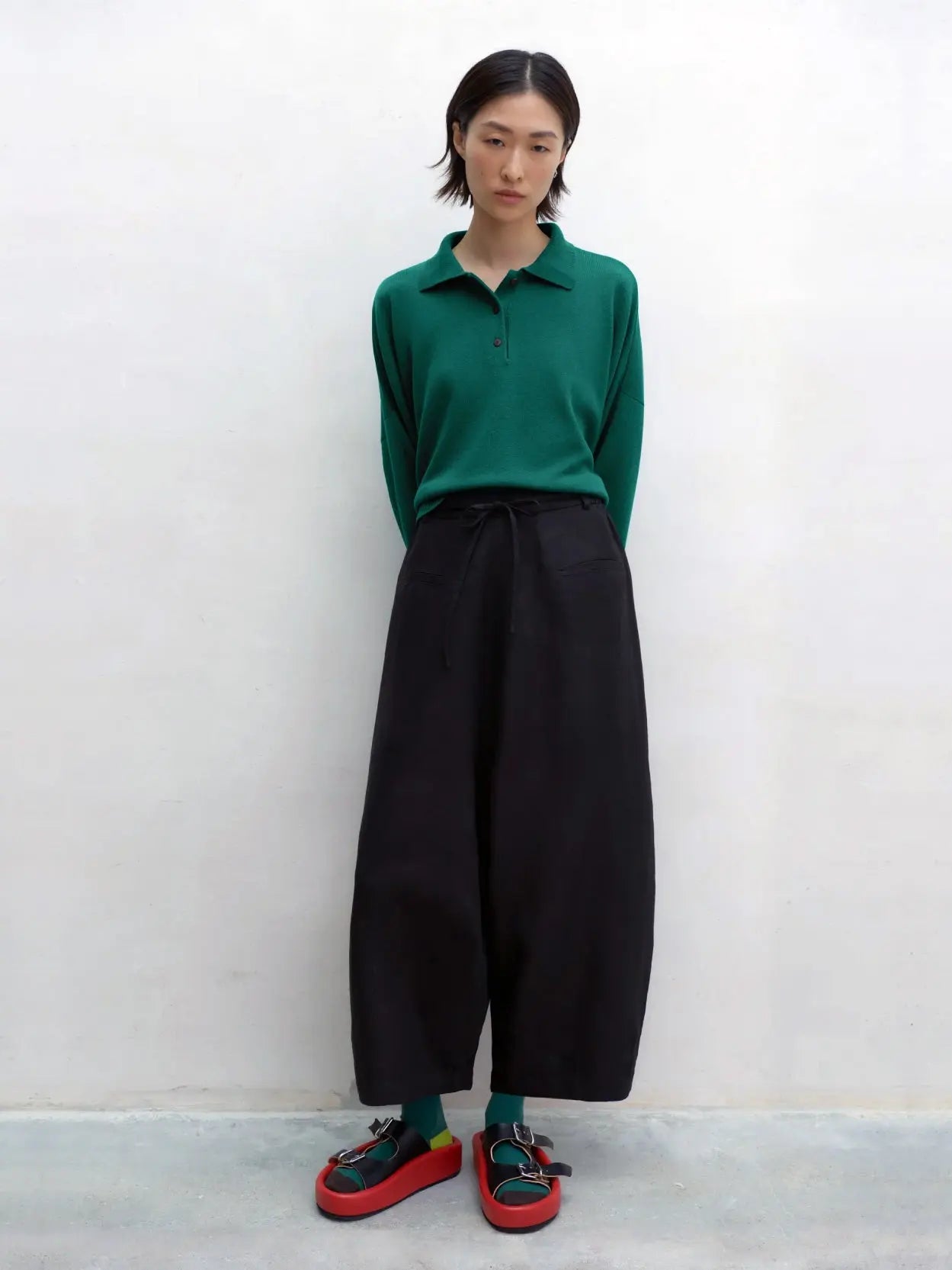 A pair of Linen Maxi Pants Black with a drawstring waistband is shown against a white background. The pants, available at Bassalstore in Barcelona, feature side pockets and have a relaxed fit. These pants are from the brand Cordera.