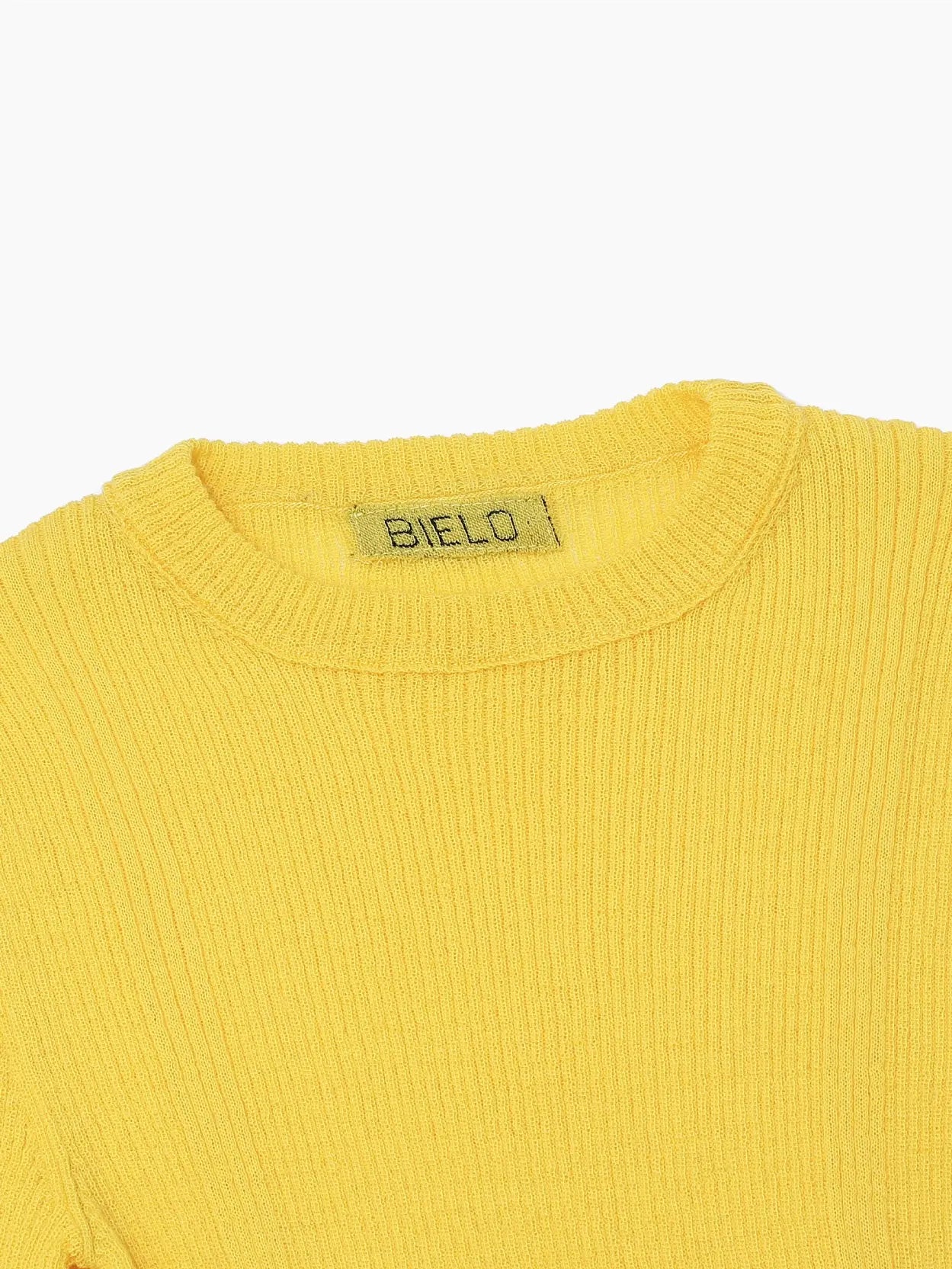 Bright yellow, long-sleeve, crew-neck sweater with a ribbed texture. The Masla Long Sleeve Yellow by Bielo has a snug fit and a simple, minimalist design, perfect for casual or semi-casual wear. Displayed on a plain white background, it's an ideal find from our Barcelona store collection at bassalstore.