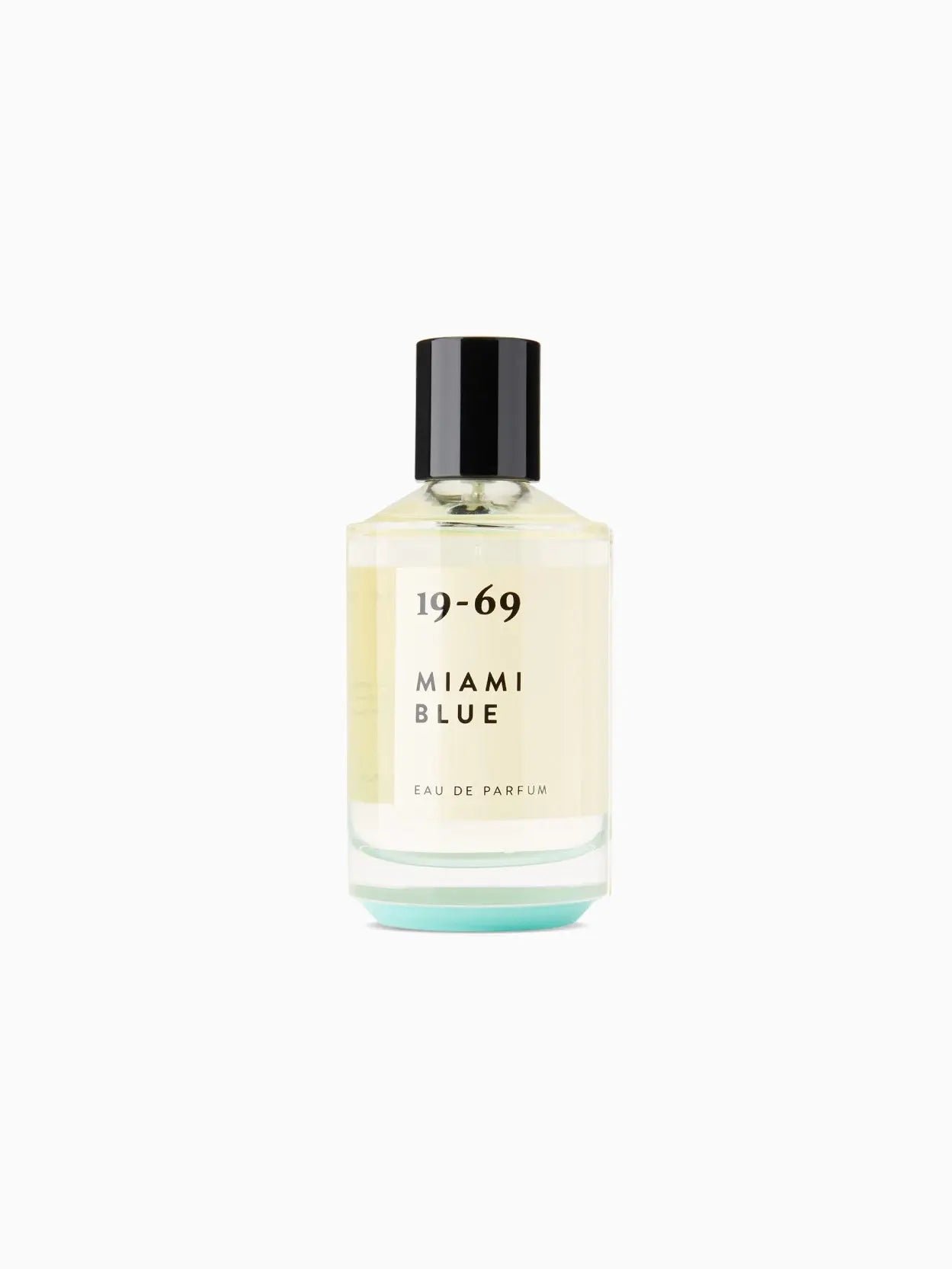 A clear glass bottle of perfume labeled "19-69 Miami Blue 100ml" with black text. The bottle, available at Bassalstore, has a black cap and contains a light yellow liquid. The text below the name reads "EAU DE PARFUM." The background is white.