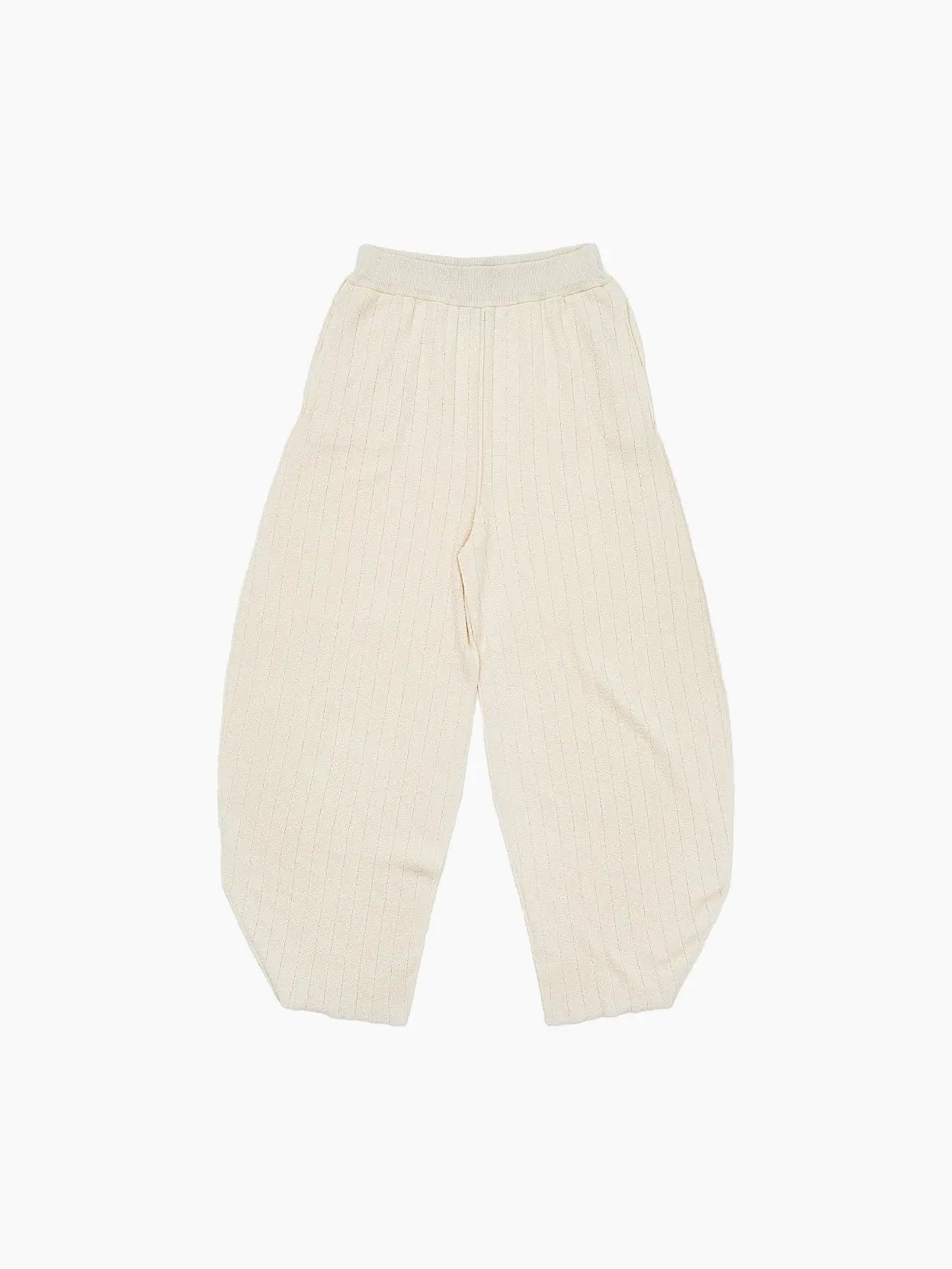 An image of a pair of Ohirune Pants Chalk from Rus. The pants feature an elastic waistband and a relaxed fit, lying flat on a plain white background.