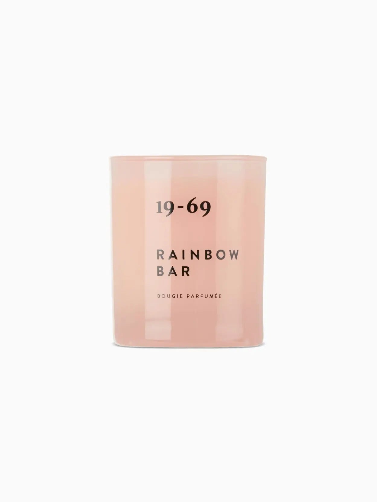 A pink candle labeled "Rainbow Bar Candle 200ml" by 19-69 in black text is displayed against a white background. The candle has a minimalistic design with its name and type "BOUGIE PARFUMÉE" printed below the main label, available exclusively at Bassalstore in Barcelona.