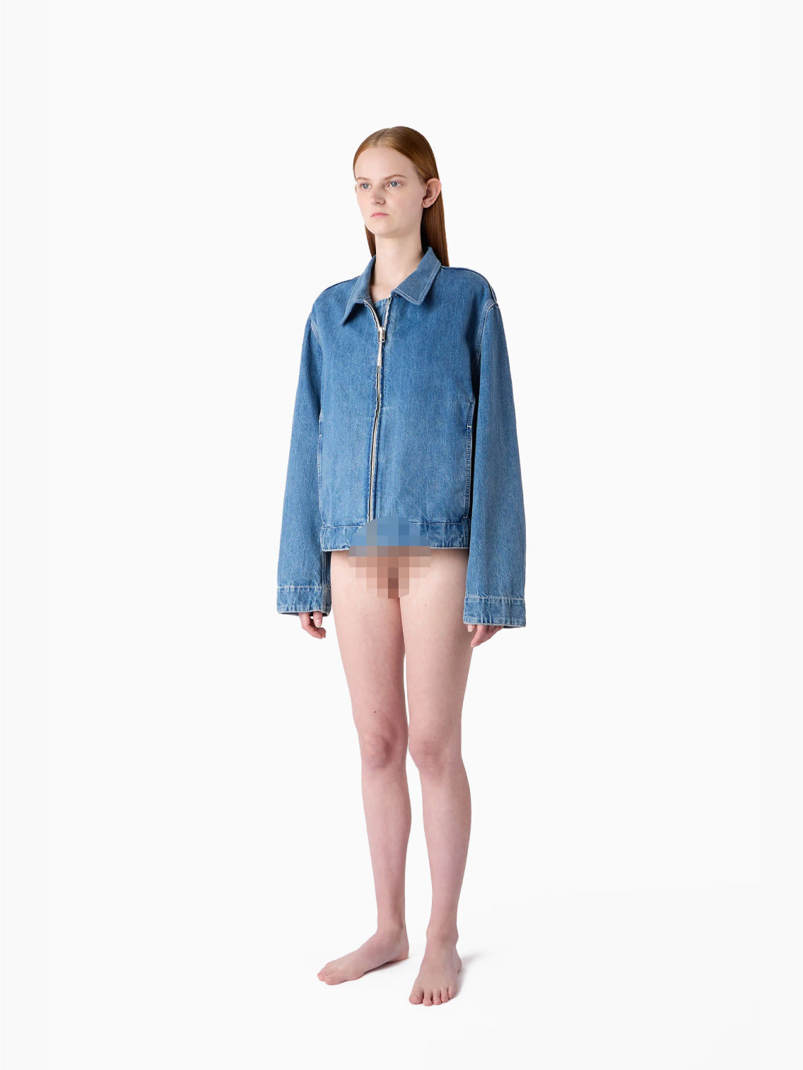 A light blue, organic bomber jacket made from raw denim, featuring a front zipper and long sleeves. The jacket includes a collar and two front pockets, exuding a casual, slightly faded look. A silicon Sunnei patch adds a unique touch, while the fabric tag inside the collar reads "Marni.