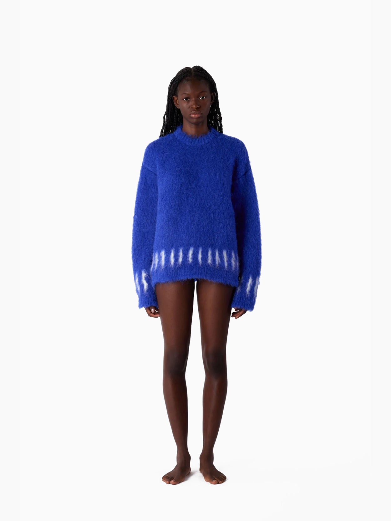 The Hairy Knit Sweater Electric Blue from Sunnei is a fuzzy piece crafted from Italian materials, showcasing white tie-dye patterns near the hem and cuffs. It is displayed against a plain white background and available in size S by Fatima.