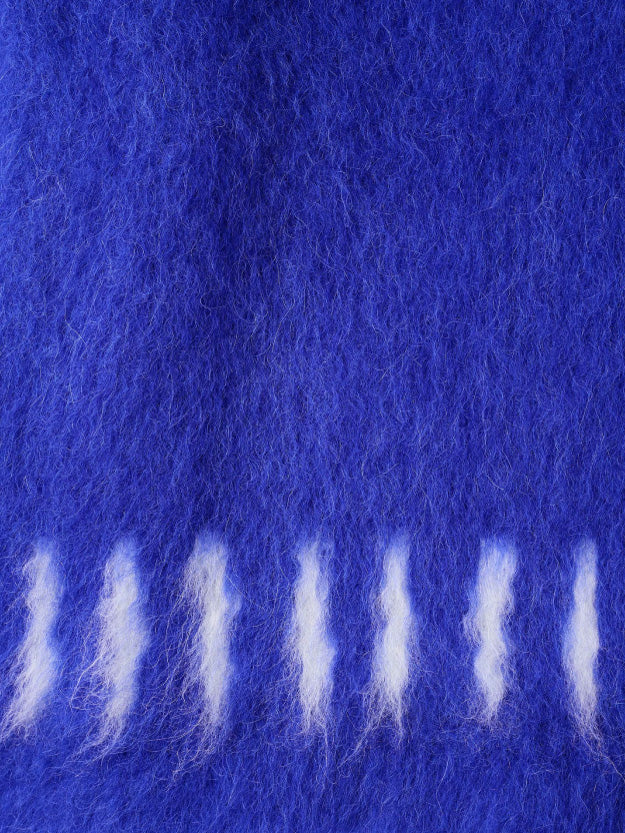 The Hairy Knit Sweater Electric Blue from Sunnei is a fuzzy piece crafted from Italian materials, showcasing white tie-dye patterns near the hem and cuffs. It is displayed against a plain white background and available in size S by Fatima.