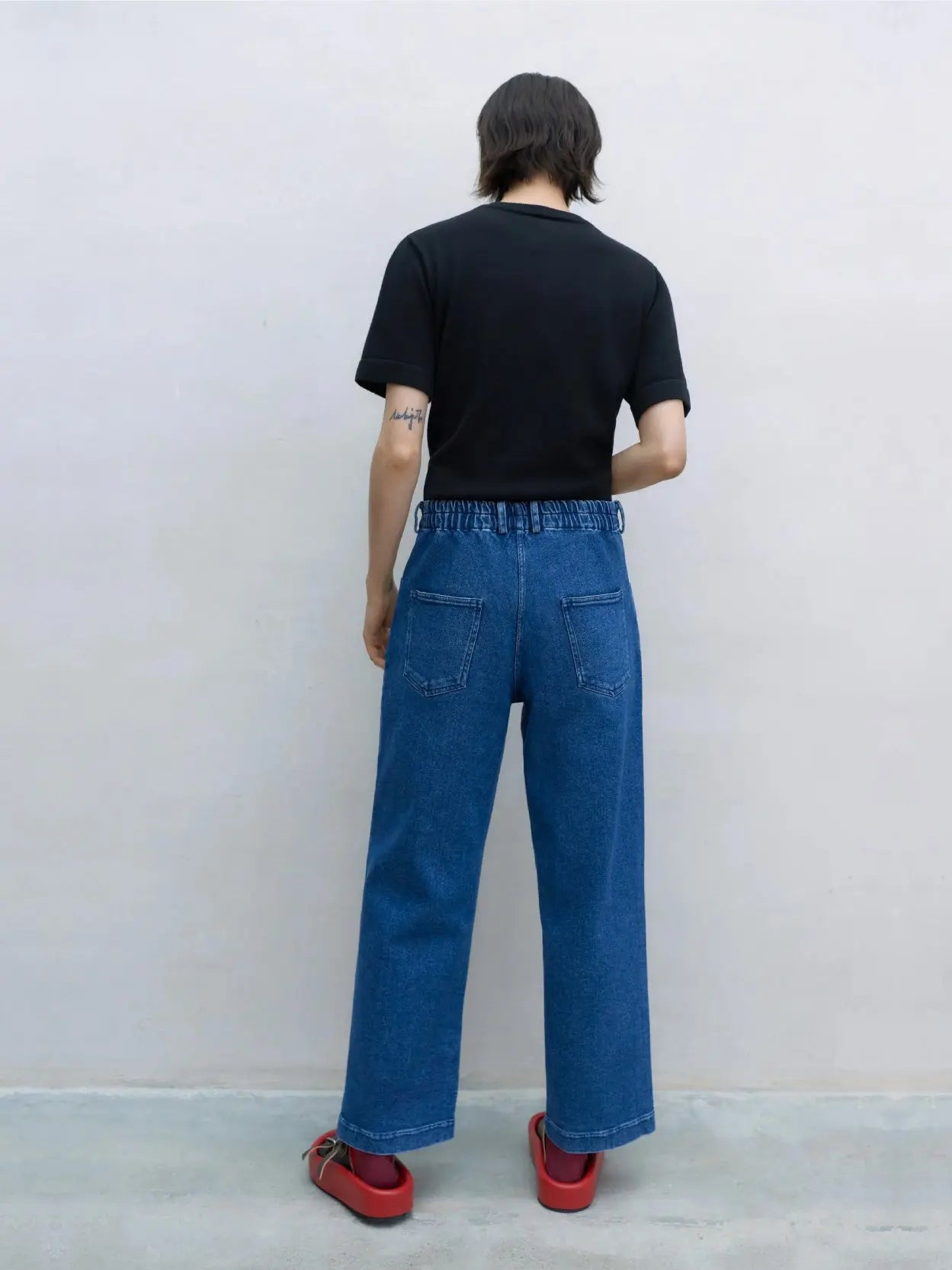 A pair of Straight Denim Pants Indigo with a high waist and straight-leg cut, available at Bassalstore in Barcelona. The Cordera pants feature a button and zipper closure, front pockets, and a simple design with no visible embellishments or distressing.