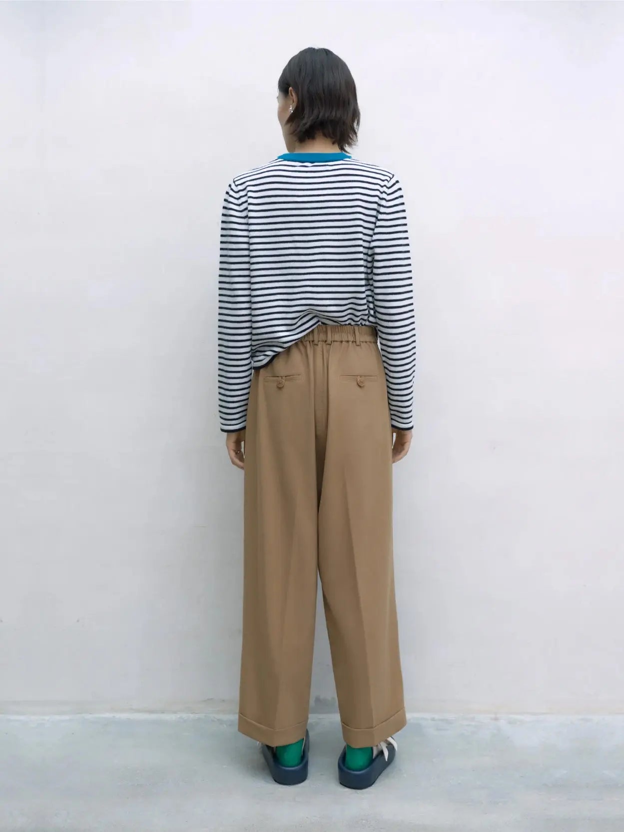 A pair of Tailoring Masculine Pants Camel by Cordera with a button closure at the waist. The pants have a straight-leg design and belt loops. They are laid flat, facing upward, against a plain white background, showcasing the timeless style available exclusively at Bassalstore in Barcelona.