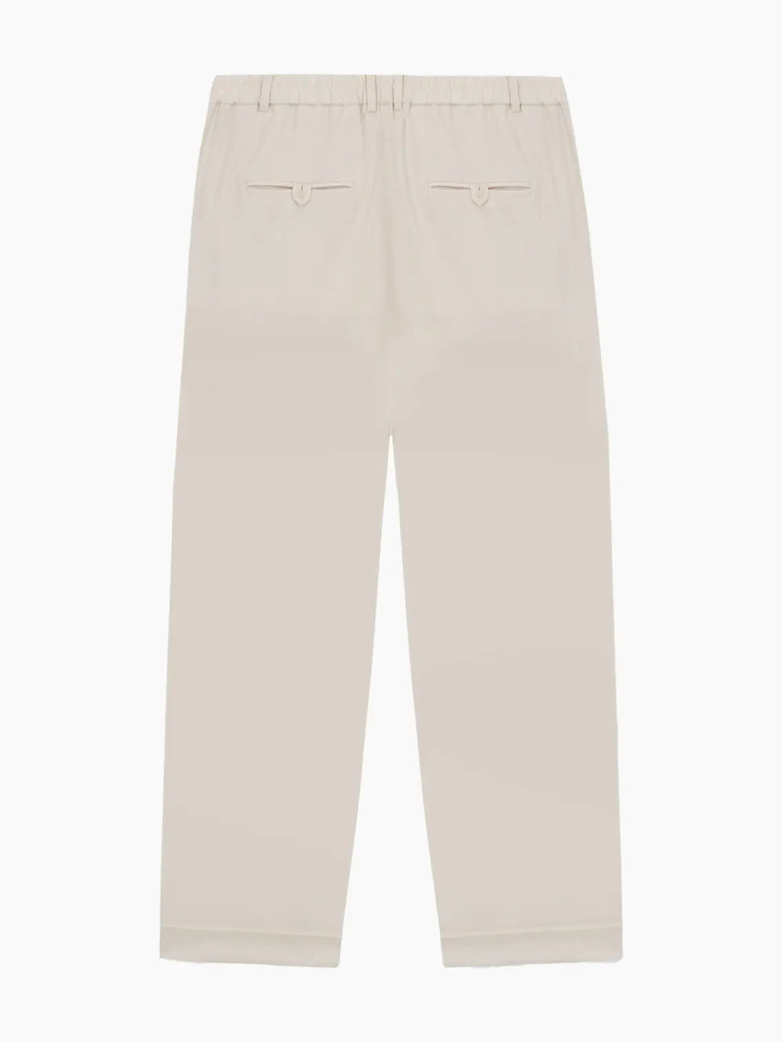 A pair of beige, high-waisted Tailoring Pants Ivory with pleats running down the front. The pants feature side pockets, belt loops, and a button closure at the waistband. With a relaxed, slightly tapered fit, these stylish trousers from Cordera are a wardrobe essential.