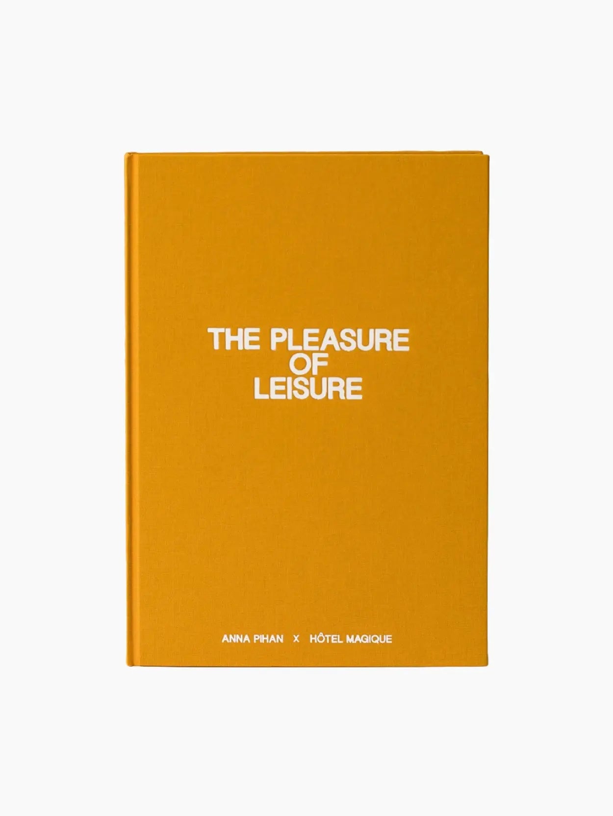 The image shows a book with a solid orange cover. The title "The Pleasure of Leisure" is printed in white text in the center of the cover. Below the title, the names "Anna Phan" and "Hotel Magique" are also printed in white at the bottom, reminiscent of an elegant Barcelona store display.