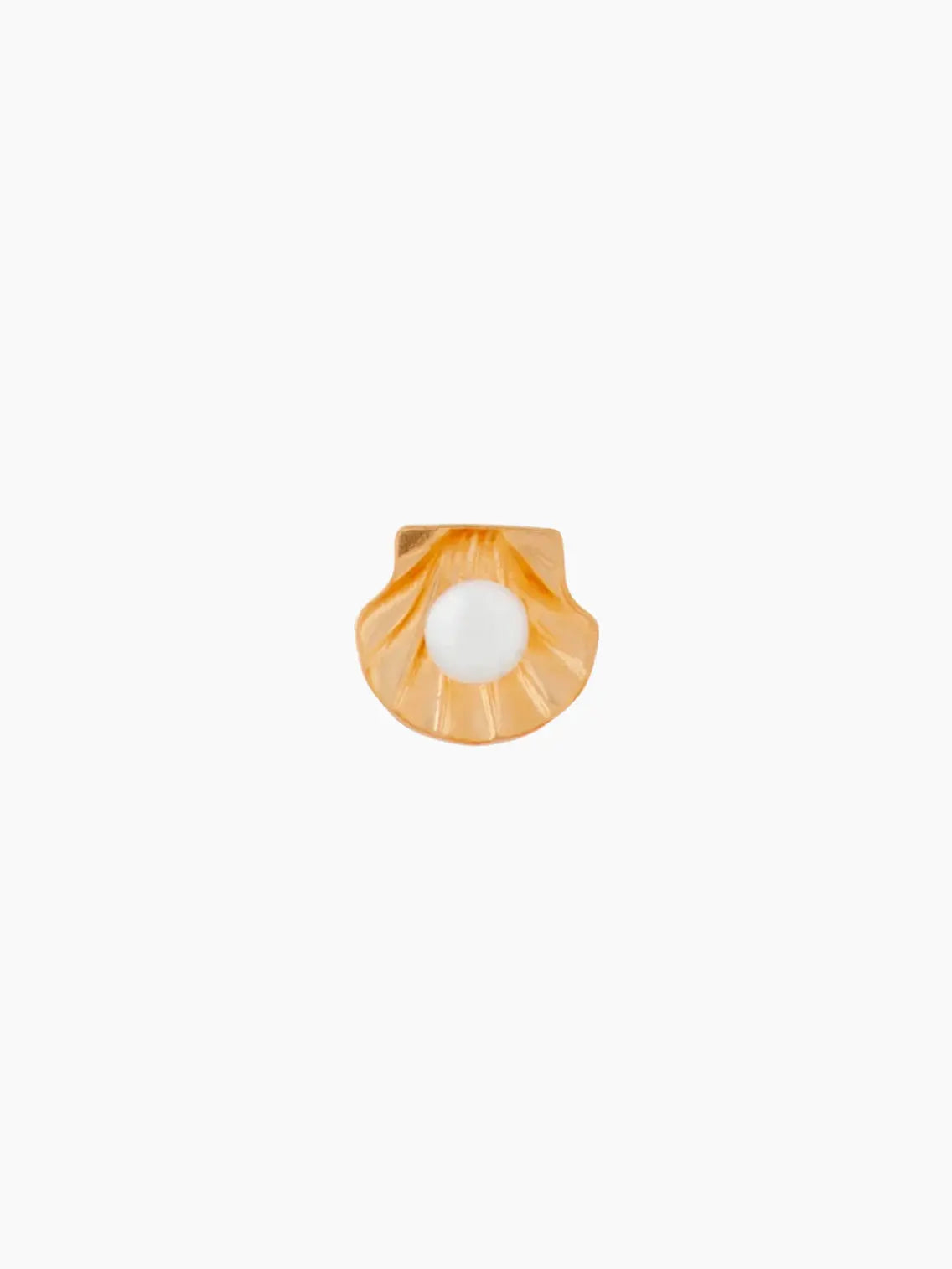 An amber-colored Under the Sea Stud Earring by Wilhelmina Garcia with a white central hole is set against a plain white background. The shell, reminiscent of treasures found in a charming Barcelona store, has a slightly curved shape with radial lines extending from the base to the edge.