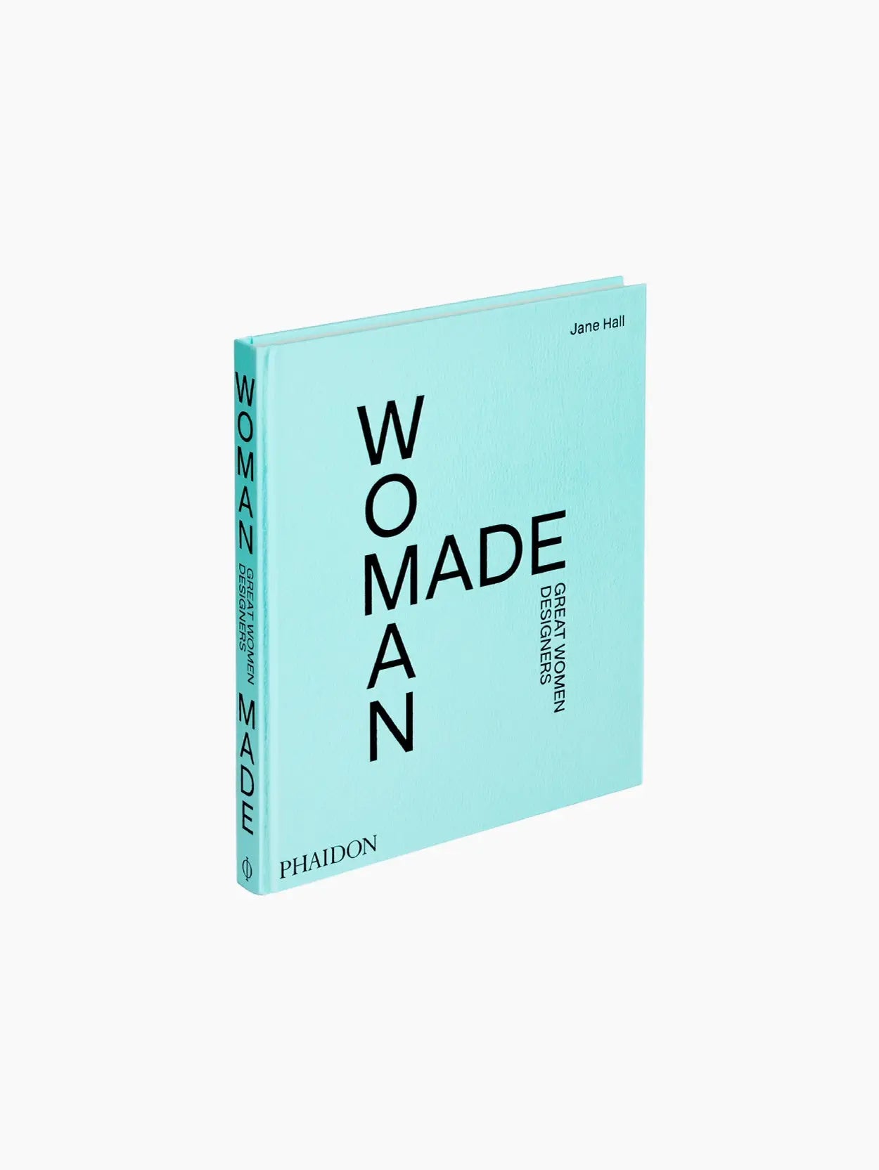 A turquoise cover of the book titled "Woman Made: Great Women Designers" by Jane Hall is elegantly displayed. The title appears vertically and horizontally in black text on the front, with "Phaidon" mentioned on the spine and bottom left corner. Available exclusively at Bassalstore in Barcelona.