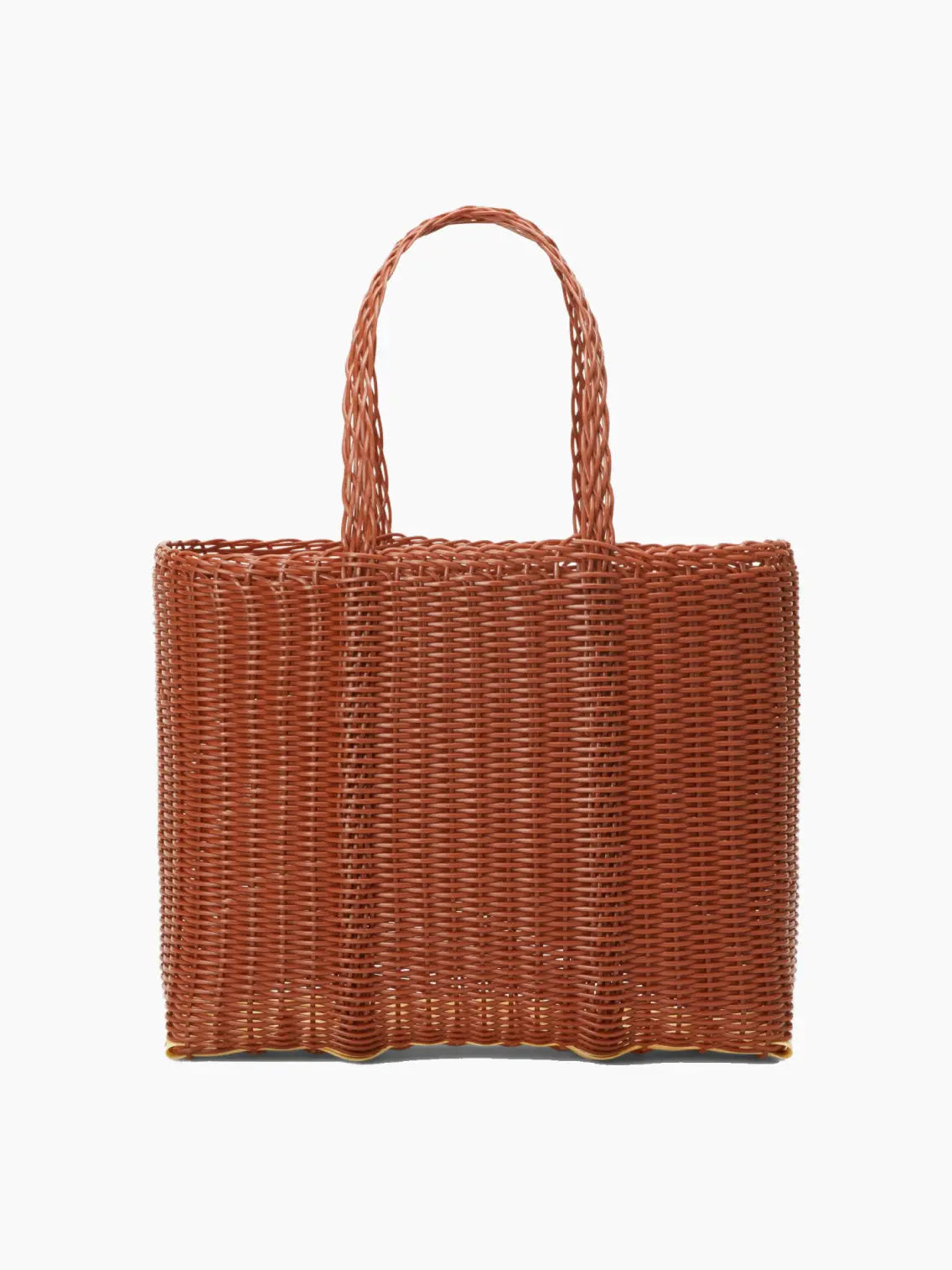 A rectangular, brown wicker handbag with sturdy double handles. The woven texture and earthy tone give it a rustic, natural appearance. Perfect for a day out in Barcelona, the Flat Small Clay Bag by Palorosa has a spacious interior, stylishly designed for practicality and fashion. Available now at Bassalstore.