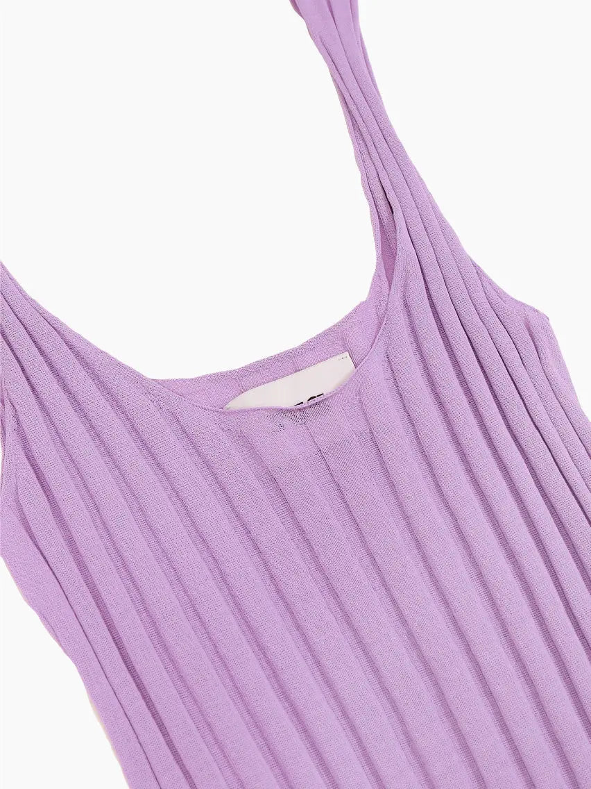 A sleeveless, lavender-colored, ribbed knit top with a scoop neckline and a slightly flared hem. It has narrow shoulder straps and vertical ribbing throughout the fabric. The Stella Top Lavender by Rus is laid flat on a white background, showcasing the elegant design available at Bassalstore in Barcelona.