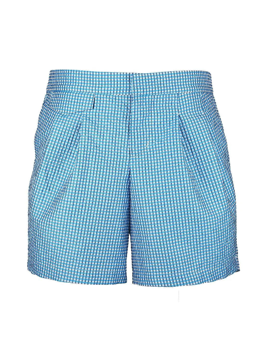 A pair of Taia Blue Swimwear by Bassal with side pockets. The fabric appears lightweight and textured, offering a casual and comfortable style perfect for strolling around Barcelona or shopping at Bassalstore.