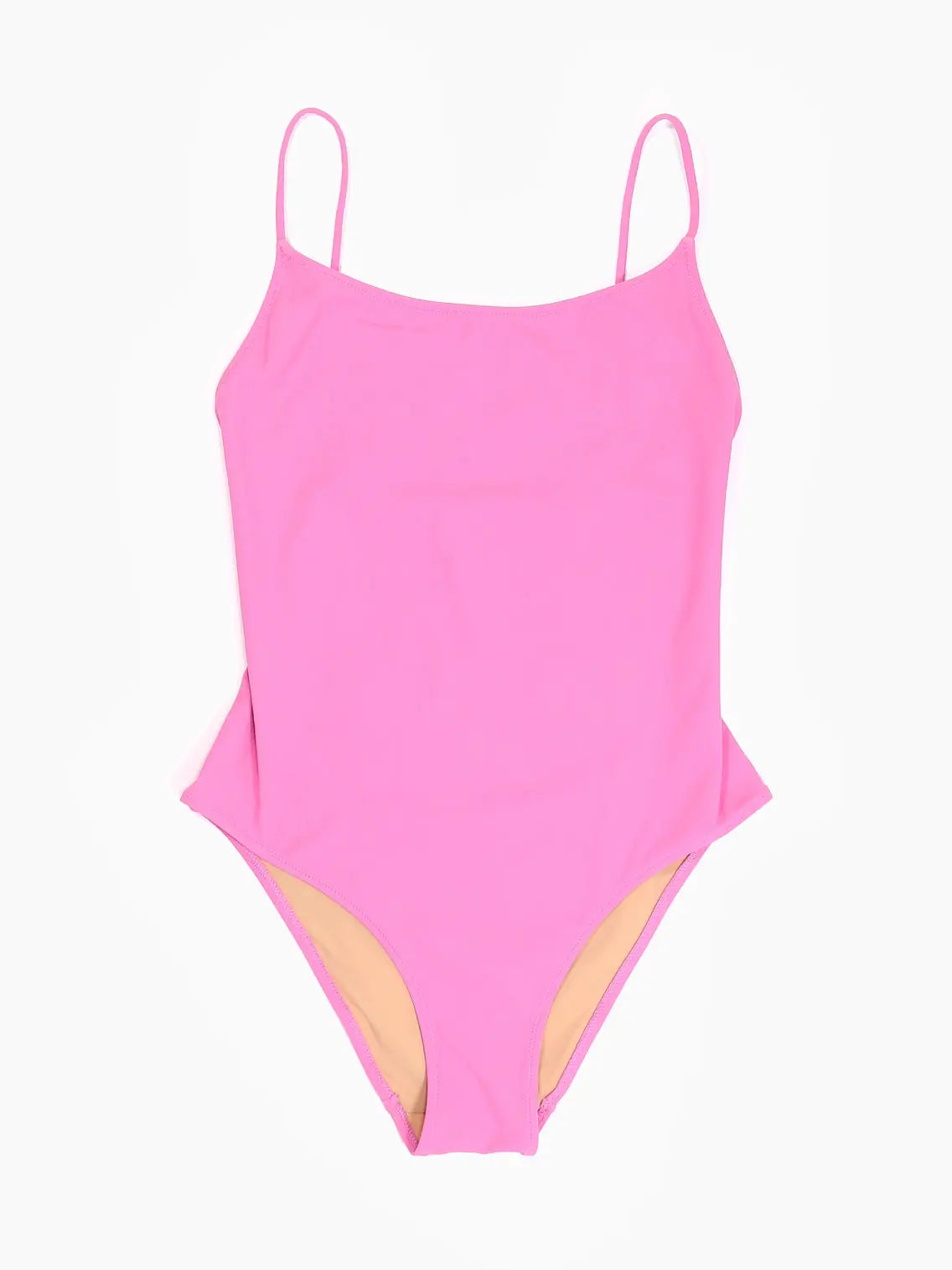 A bright pink one-piece swimsuit with thin shoulder straps and a high-cut design is showcased on a white background, highlighting its simple yet stylish look. This elegant piece, Trentasei Swimwear Pink by Lido, available exclusively at Bassalstore, perfectly captures the vibrant spirit of Barcelona fashion.
