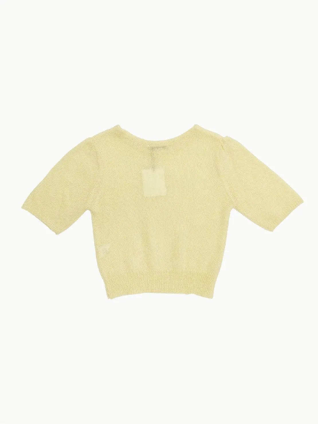 A light yellow, short-sleeved, knitted Yellow Balloon Sleeve Pullover from Amomento is pictured against a plain white background. The sweater features a simple, round neckline and appears to be lightweight with a soft texture. Perfect for those sunny Barcelona days.